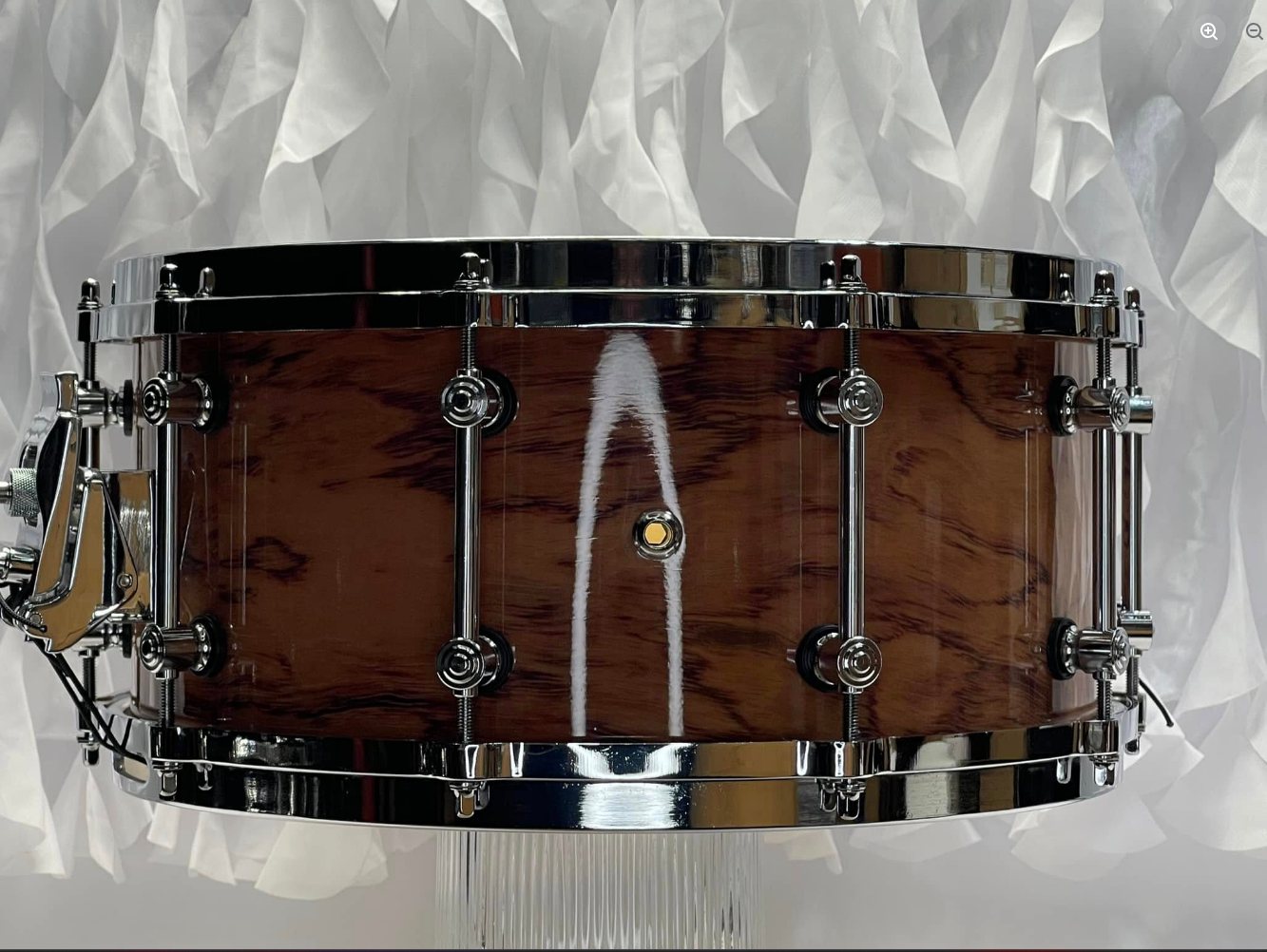 Custom 14x6.5 bubinga maple snare drum with rerings, 45mm snare wires, and aluminum die-cast rims