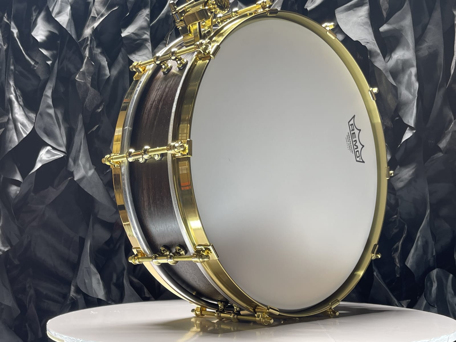 Custom 14x4 steam-bent rosewood piccolo snare drum with brass hardware and brass tube lugs