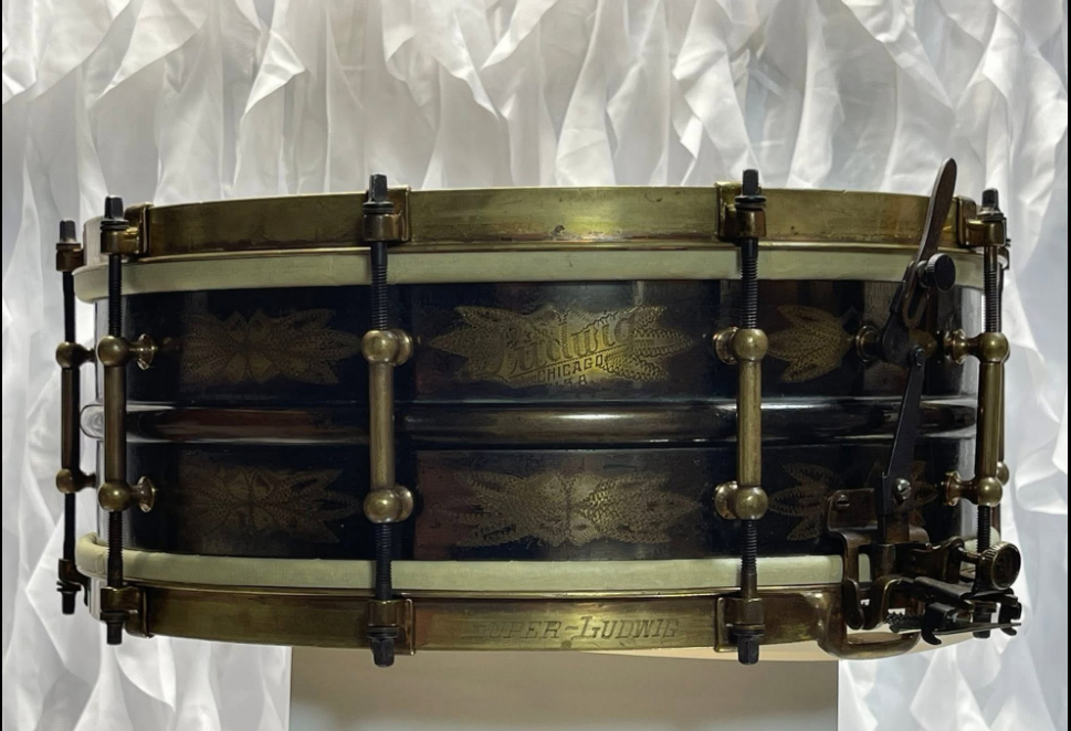 Ludwig De Luxe No. 231 snare drum full shell profile showing the engraved shell, Ludwig Chicago badge, and brass tube lugs